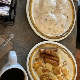 Gravy, biscuits with sausage links, and homemade fries.
