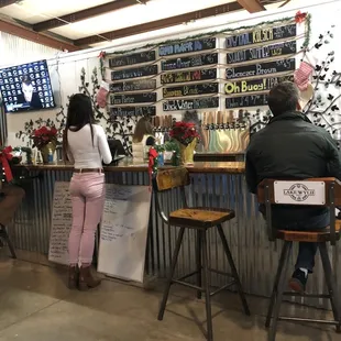 a man and a woman sitting at a bar