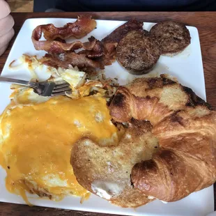&quot;The Lauderdale&quot; with a cheddar cheese (choice of cheese), sausage (choice of meat) and a croissant (choice of bread)
