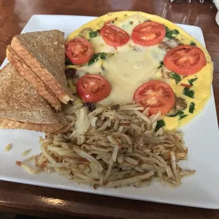 Vegetable omelet with mozzarella (choice of cheese), added sausage, hash browns (choice of potato), and wheat toast (choice of bread).