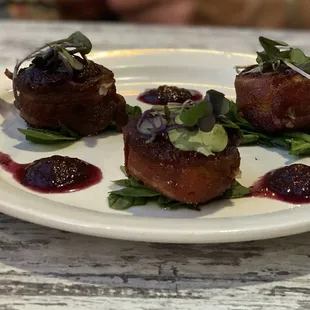 Bacon wrapped scallops with a blueberry reduction for an appetizer. Delicious.