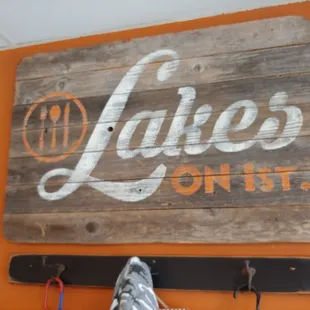 a wooden sign hanging on a wall