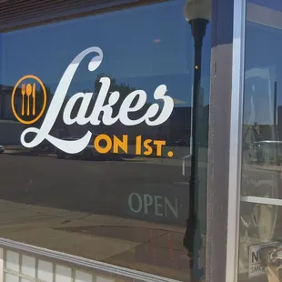 the reflection of a parking meter in the window