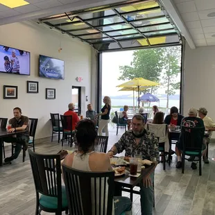 people sitting at tables eating