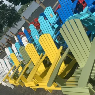 a row of brightly painted adiron chairs