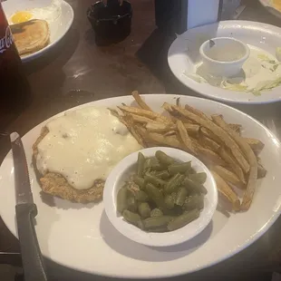 chicken fried steak with white gravy, fries, and green beans 11.95$
