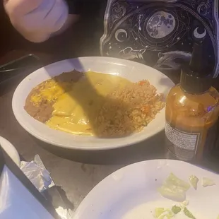 cheese enchiladas with rice and refried beans  11.95$