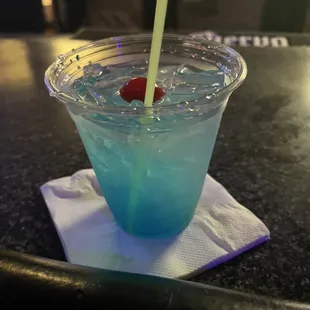 a drink in a plastic cup with a straw