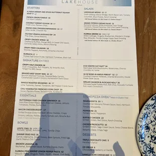 a table with a menu and a plate of food