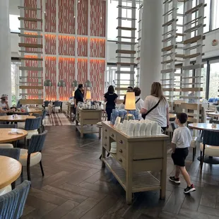 a dining area with tables and chairs