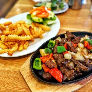 Stir Fried Cubed Beef Filet Mignon with a side of fries and a salad. : )