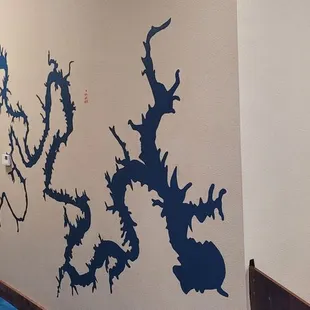 a long hallway with blue paint on the walls