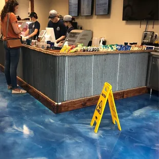 Cool nautical theme to Lakeside Subs. Flooring has a blue water appearance