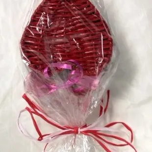 a basket of chocolates wrapped in plastic