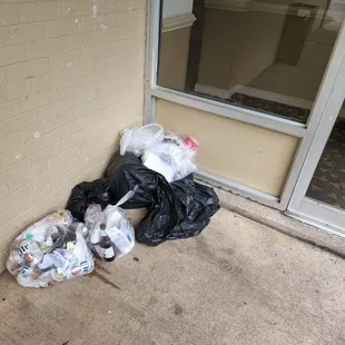 Trash by an entryway