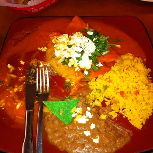 Enchiladas, refried beans &amp; rice.
