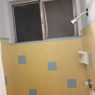 Bathroom with a broken screen &amp; window