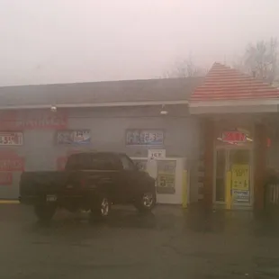 a truck parked in front of a gas station