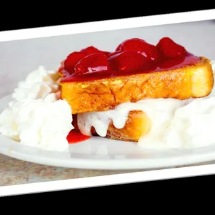 a plate of french toast with whipped cream and strawberry jam