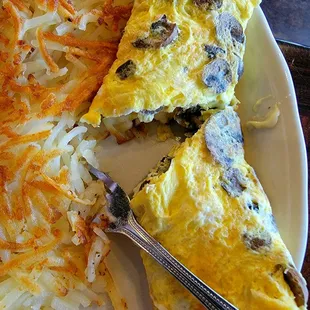 Wild Mushrooms &amp; Swiss Cheese 3 egg omelet $11.24 with hashbrowned potatos ( 4 options for sides ) Very flavorful &amp; filling