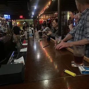 people sitting at a bar