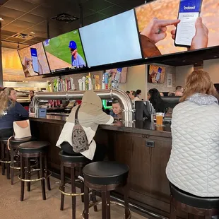 people sitting at the bar
