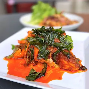 Spicy Tilapia w/ thai chili sauce, finger root, kaffir lime leaf, red bell peppers, crispy basil | $21.95