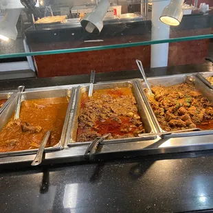 a variety of food items in a buffet
