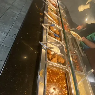 a buffet with a variety of food items