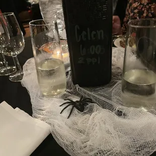 a bottle of booze with a spider on it