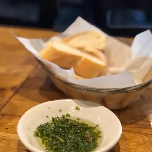 a bowl of bread and a bowl of pesto