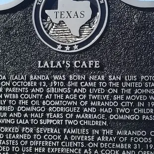 a plaque describing the location of the restaurant
