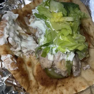 a pita with lettuce and meat