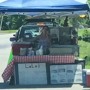 a woman sitting in the back of a truck