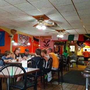 The dining room is dark and a little dingy, but colorful and quiet.