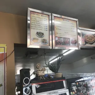 menus on the wall above the counter