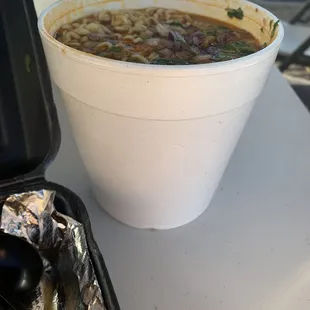 a bowl of soup in a plastic container