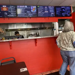 Menu above and the kitchen area