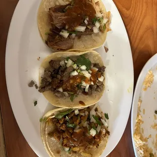 Carnitas, asada, al pastor (top to bottom)