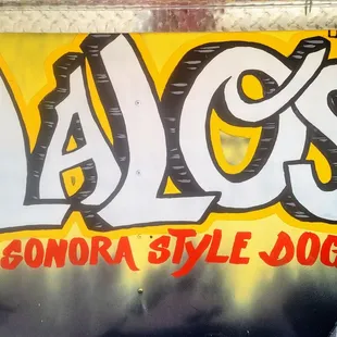 a yellow and black sign