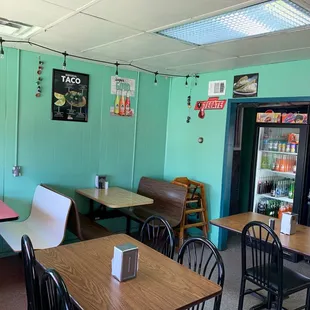 Seating area in Lalos. Notice the Flan sign on the top left. When you come, get it. It&apos;s the best in the 4-state area!!!!