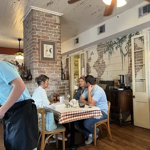Love the wood floors and old fireplace!