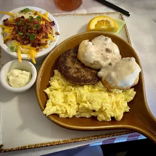 LaLou biscuits and gravy with scrambled eggs, sausage, and LaLou grits.