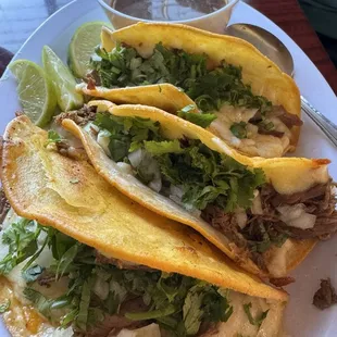 Quesabirria tacos with onions, cilantro and a great dipping broth