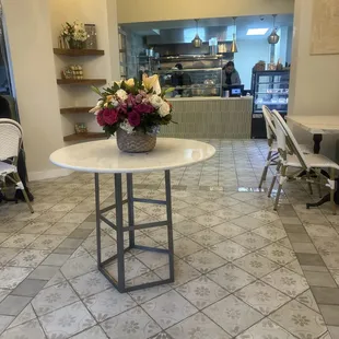 a table with a basket of flowers on it