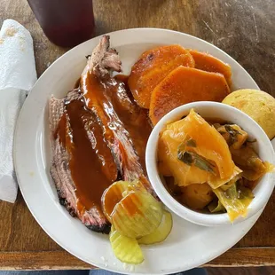 Sliced brisket, yams and cabbage/collard combo.