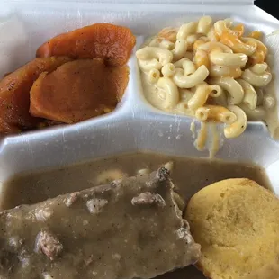 Hamburger smothered in gravy, yams and Mac and cheese