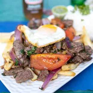 Lomo Saltado ($19 + $1.50/egg)