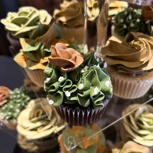 a variety of cupcakes on display