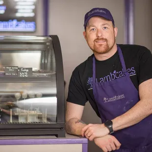 a man standing in front of a counter